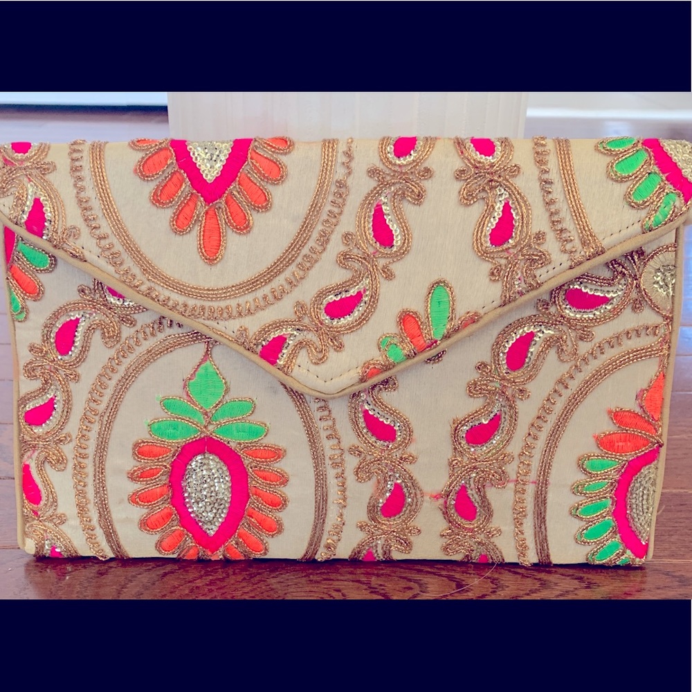 Women’s embroidered fold over clutch hand bag.